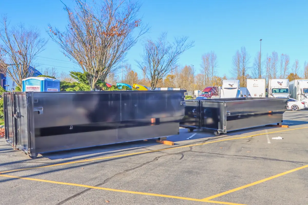 Professional dumpster rental service with roll-off container on residential driveway in Sedona